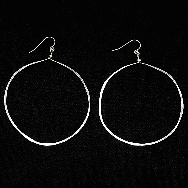 Ladies fanciful twist earrings -Artisan Hammered Silver Hoop Earrings by Brin