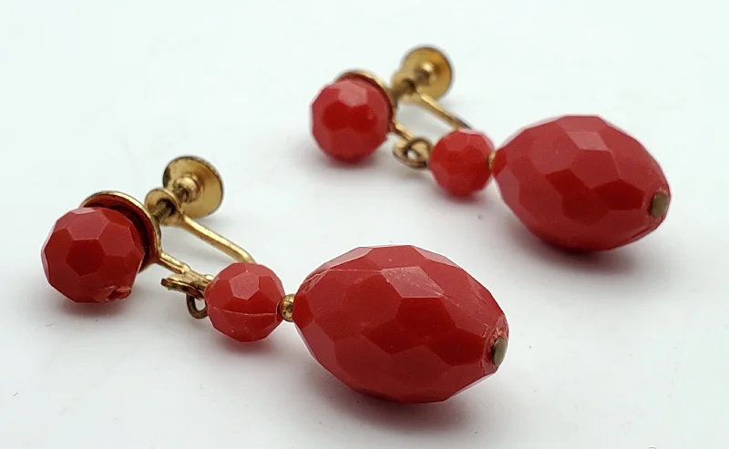 Ladies pristine white earrings -Vintage Faceted Red Plastic Bead Dangle Screw Back Earrings